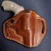 Brown Leather OWB Thumb Break Holster in smooth Standard Saddle Brown vegetable oiled leather with white stitching, belt slots, and a one way snap retention strap.