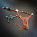 Brown leather belt holster set laid flat with blaster and matching accessories