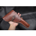 Brown Leather Flap Hunting Holster held in hand showing full front profile and flap closure