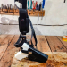Leather chest holster displayed on workbench showing holster body and harness assembly