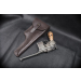 Holster displayed with long barrel handgun on black leather surface