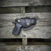 Black leather holster with horizontal draw side view
