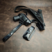 Black leather Walther PPK/S shoulder holster set laid flat with pistol holster, magazine pouch, and adjustable strap system