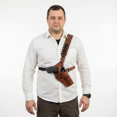 Brown Leather Forester Chest Holster worn on the chest, showing front view of adjustable leather harness and secure handgun carry