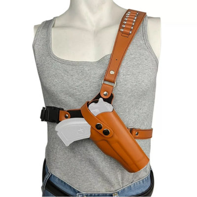 Tan leather chest carry holster worn on front torso with adjustable cross body harness