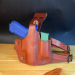 Brown Leather Drop Leg Holster with Integrated Magazine Pouch with training pistol and spare magazine on display