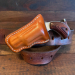 Brown leather pocket clip revolver holster front view with molded leather body