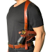 Brown leather shoulder holster worn under the arm with horizontal carry over black t-shirt