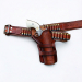 Doc Holliday Western crossdraw gunfighter rig with leather holster and cartridge belt laid flat