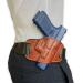 Brown leather OWB pancake belt holster worn on belt showing close to body fit