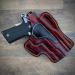 Mahogany leather OWB holster with thumb break retention handcrafted from vegetable tanned cowhide