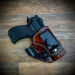 Medium brown AIWB leather holster with concealment claw and belt clip for appendix carry