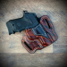 Walnut finish OWB leather belt holster showing molded fit and reinforced stitching