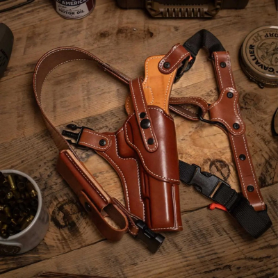 Brown premium leather adjustable chest rig holster displayed with full harness system