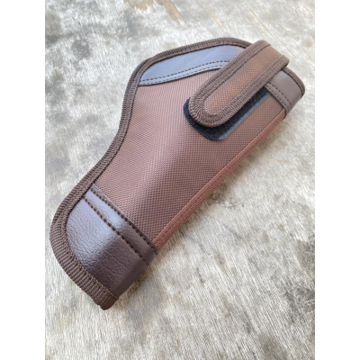 Brown nylon hunting belt holster angled top view with secure strap and reinforced trim
