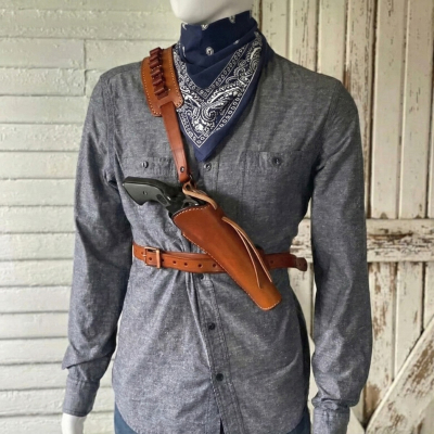 Brown leather Western shoulder holster rig with cross-body strap