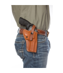 Tan leather hip holster worn OWB on belt for strong-side carry