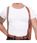 Brown basketweave leather shoulder holster worn under arm showing harness fit and vertical carry position