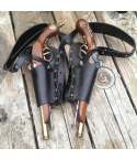 Black leather dual flintlock shoulder holster shown in flat lay on wooden surface