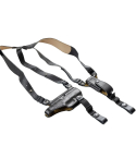 Black leather shoulder holster harness with adjustable straps laid flat on white background