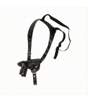 Black leather single shoulder holster with vertical carry design, adjustable harness, and elastic support strap on a white background