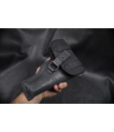 Black Leather Patrol Flap Holster held in hand showing full cover flap and enclosed field carry design