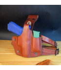 Brown Leather Drop Leg Holster with Integrated Magazine Pouch with training pistol and spare magazine on display