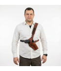 Brown Leather Forester Chest Holster worn on the chest, showing front view of adjustable leather harness and secure handgun carry