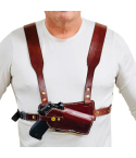 Brown leather chest holster harness worn on chest showing secure field carry position