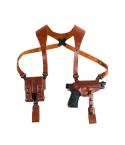 Classic leather shoulder holster system laid flat showing full harness and accessory layout