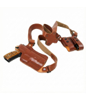 Handcrafted leather horizontal shoulder holster with adjustable harness and dual magazine pouches for concealed carry