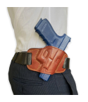 Brown leather OWB pancake belt holster worn on belt showing close to body fit