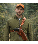 Model wearing a brown leather cross-chest bandolier holster for a revolver with cartridge loops.