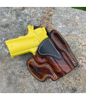 Walnut woodgrain finish OWB leather belt holster showing molded profile and reinforced stitching