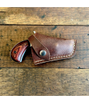 Brown leather pocket revolver snap holster front view with retention strap
