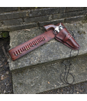 Western Leather Buscadero Gunbelt with Revolver Holster and Cartridge Loops shown on outdoor stone steps