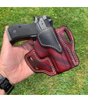 Mahogany woodgrain leather OWB holster showing molded fit and belt slots